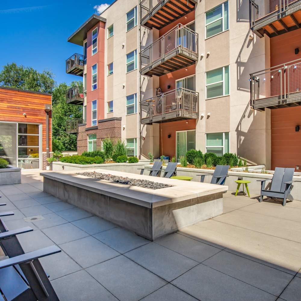 Outdoor firepit with seating at Park Place Olde Town Apartments in Arvada, Colorado