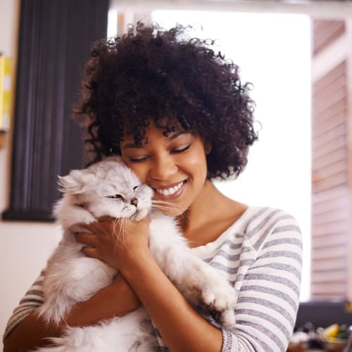 A resident with her cat at On Base Housing in Yuma, Arizona