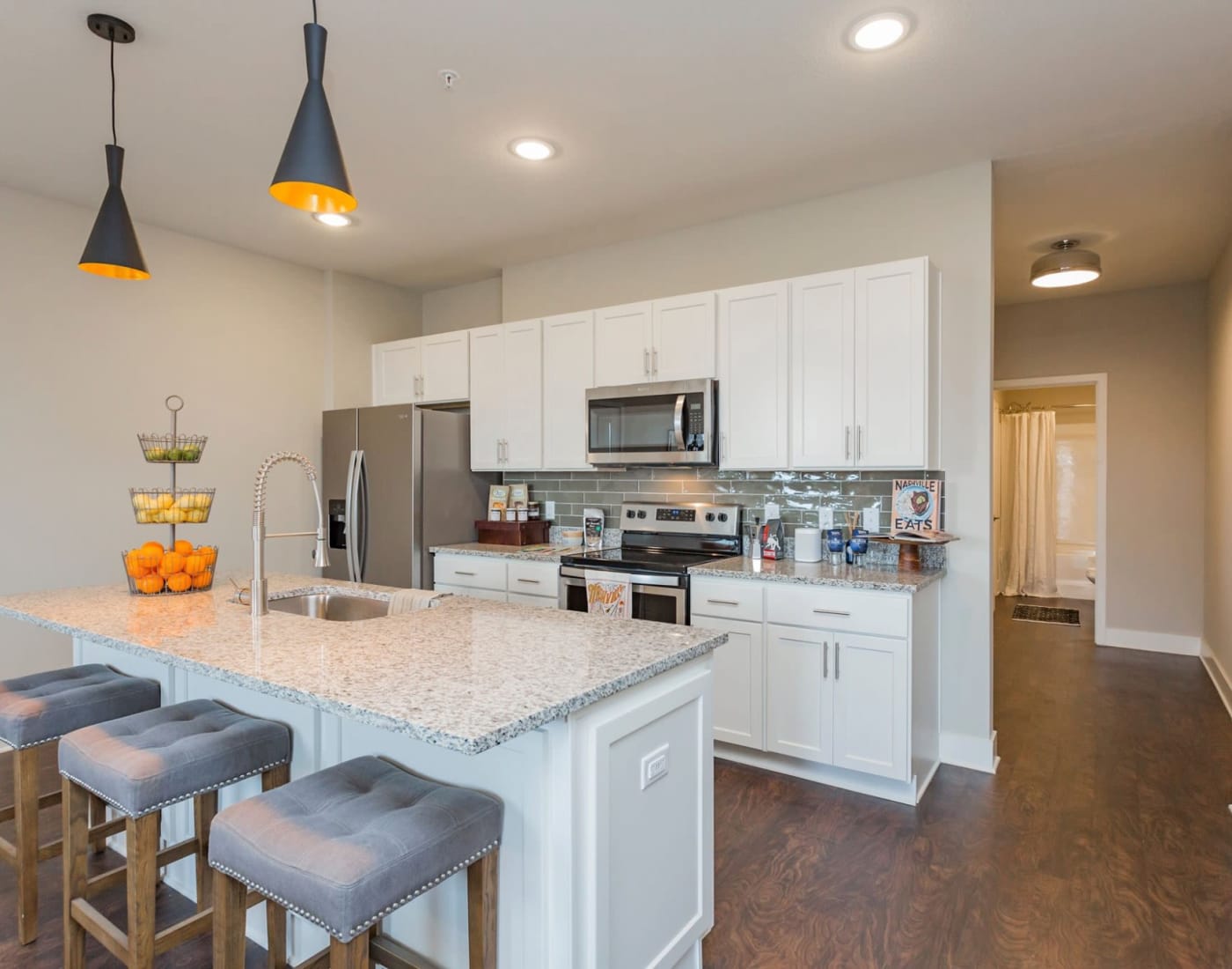 Kitchen with a breakfast bar at Rivertop Apartments in Nashville, Tennessee