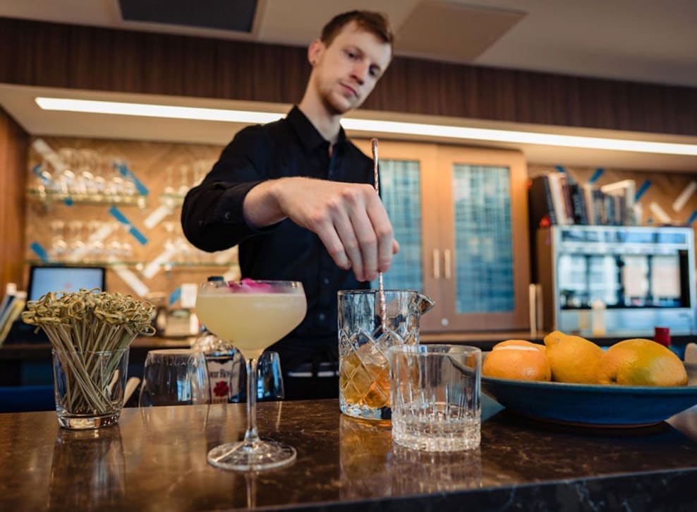 Bartender making drinks at Murano in Seattle, Washington