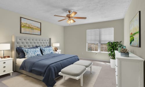 An apartment bedroom with an attached bathroom at Retreat at Ragan Park in Macon, Georgia