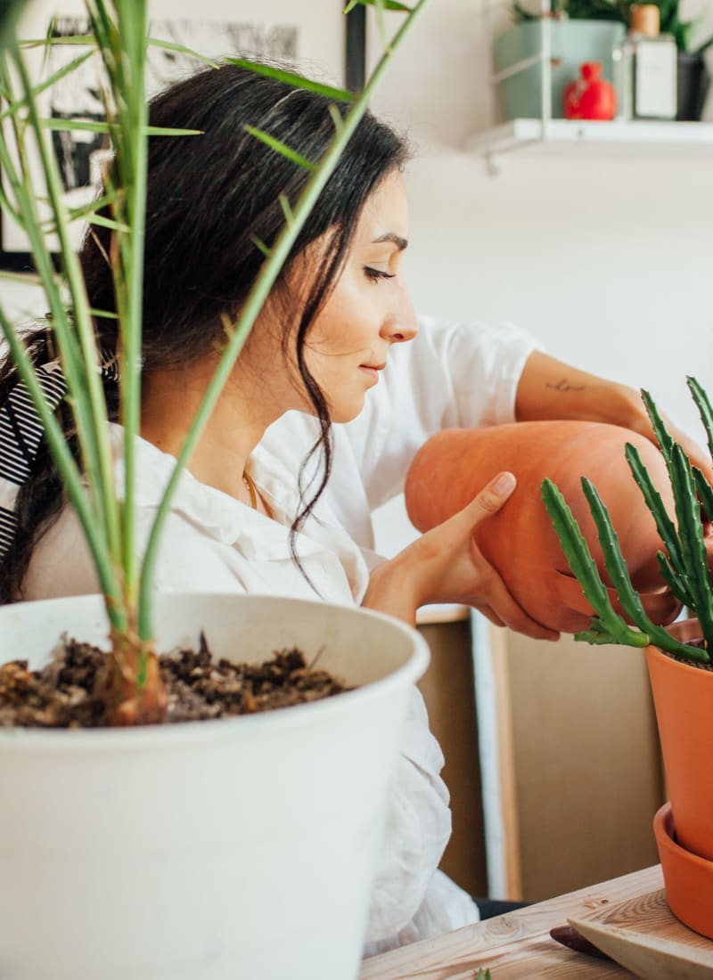 Resident watering her plants at Marquis at Silverton in Cary, North Carolina