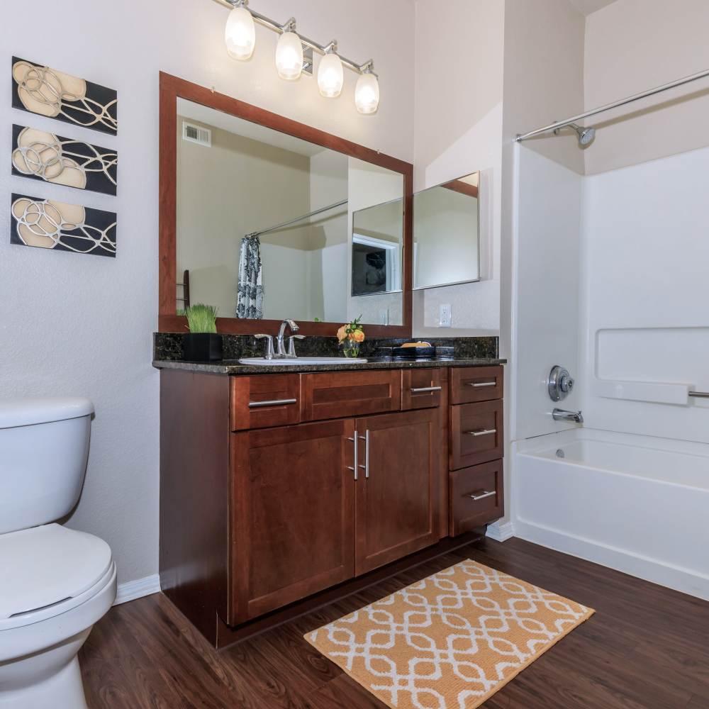 Bathroom with bathtub and vanity at One Belmar Place in Lakewood,Colorado