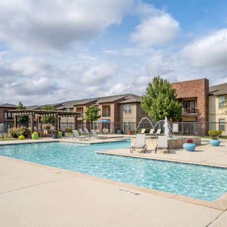 Exterior and sparkling pool of Anatole at City View in the afternoon