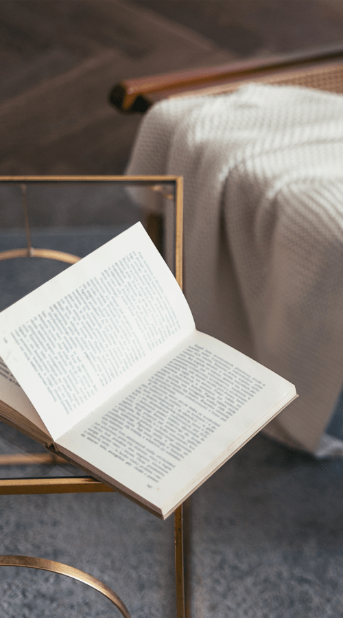 Close up of book on a glass coffee table at Pillars Senior Living in Lakeville, Minnesota