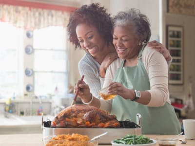 Resident cooking a family meal at Hudson Oaks Active Adult Living in Bryan, Texas