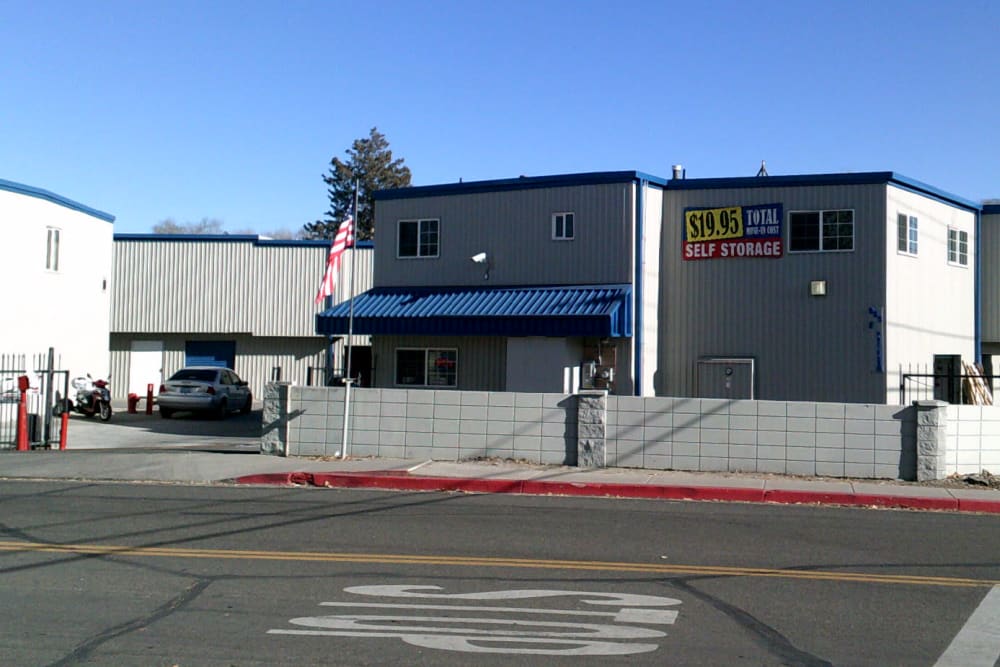 Exterior of A-American Self Storage in Reno, Nevada with gated entry