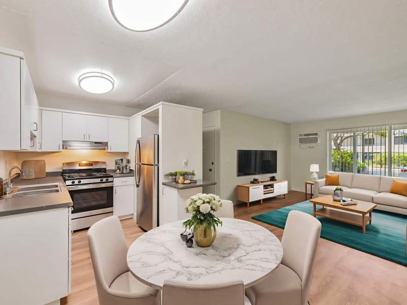 Spacious living room and kitchen in one image at San Jose Gardens in San Jose, California