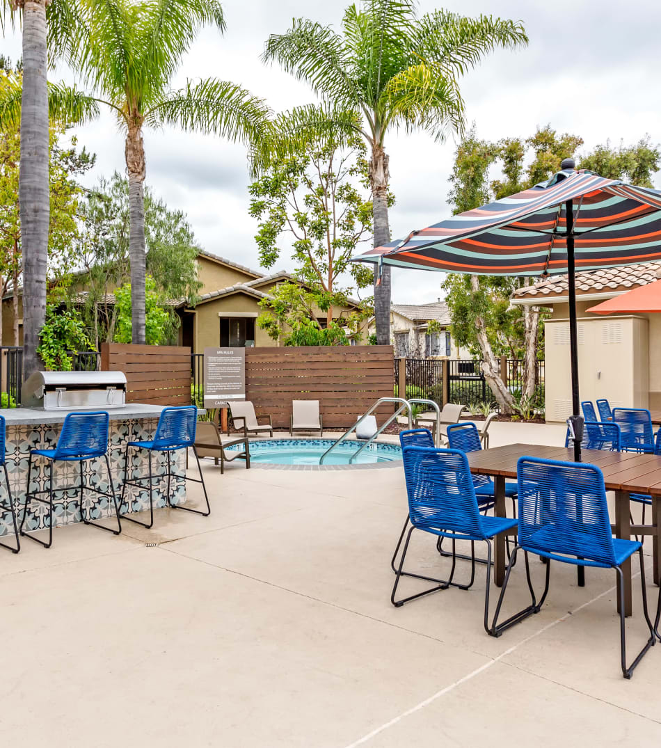 Barbecue area with gas grills near the swimming pool at Sofi Westview in San Diego, California