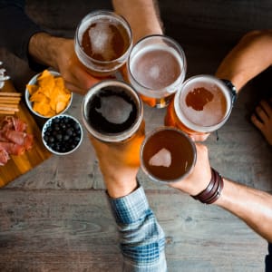 Friends raising a toast to the good life at Sycamore Canyons Apartments in Riverside, California