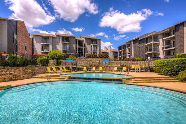 Resident dipping her toes in the pool at Canyon Grove in Grand Prairie, Texas