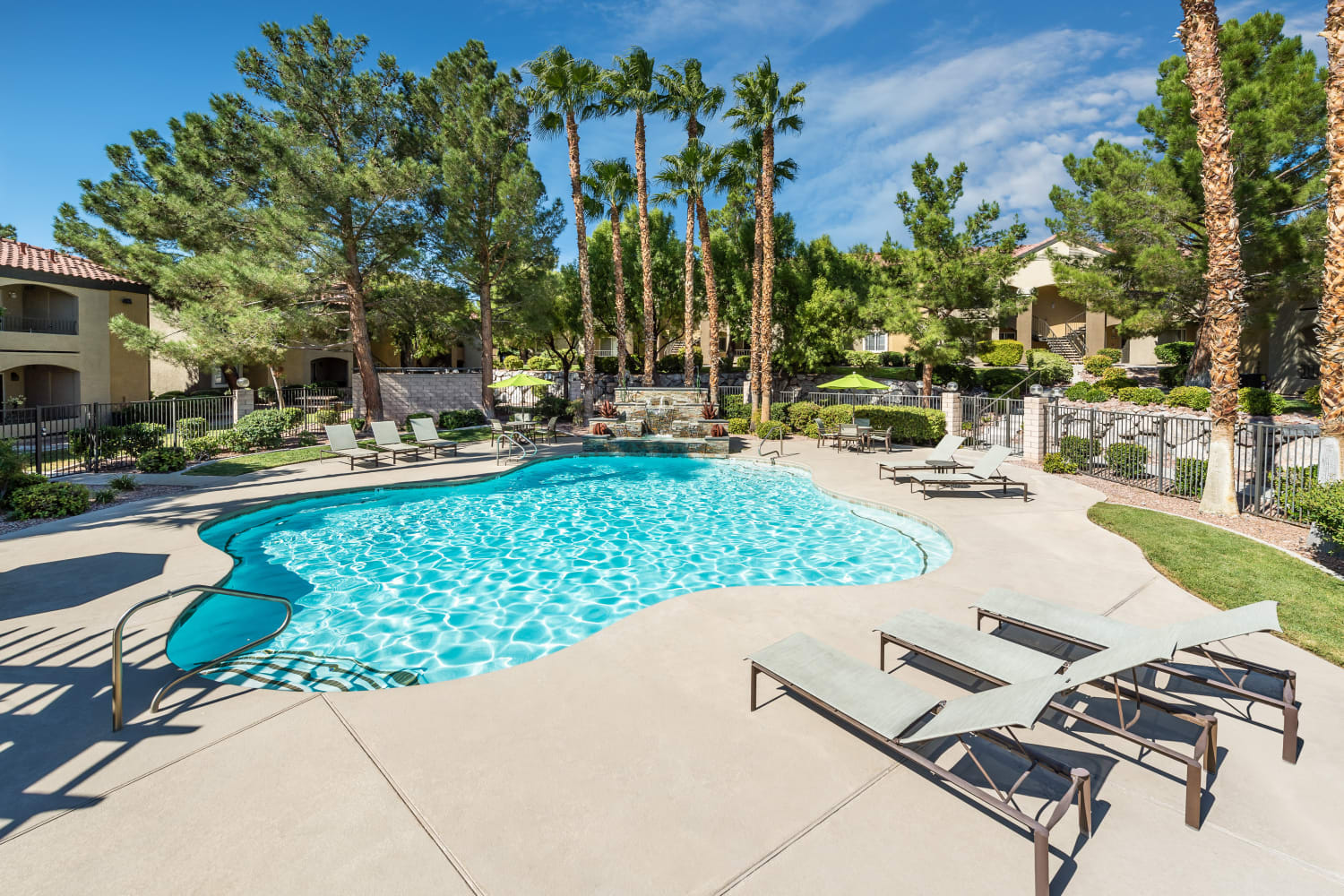 Enjoy warm sunshine and a sparkling swimming pool at Rancho Destino Apartments in Las Vegas, Nevada