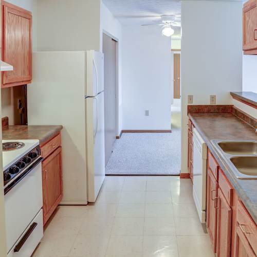 Kicthen showing sleek modern appliances with tile flooring at Heritage Greene in Washington Court House, Ohio