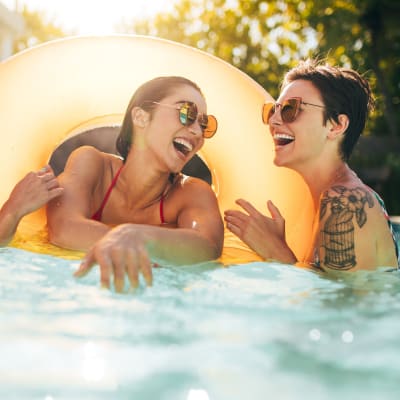 Residents laughing in the pool at San Mateo Point in San Clemente, California