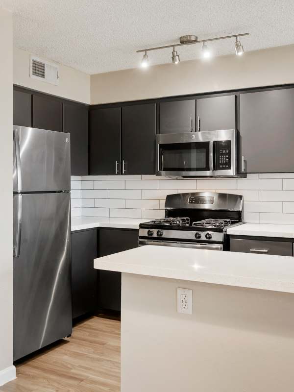 Kitchen with stainless-steel appliance at Sentry Tempe in Tempe, Arizona