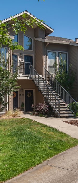 Grassy lawn for playing fetch with your furbaby at Deer Valley Apartment Homes in Roseville, California