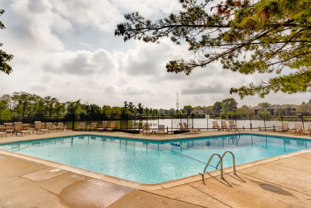 Swimming pool with a large sundeck at Lakeside Apartments in Wheaton, Illinois