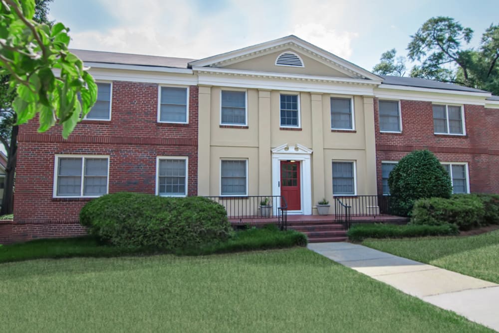 Building with landscaped lawn at HillCrest Apartments in Columbus, Georgia