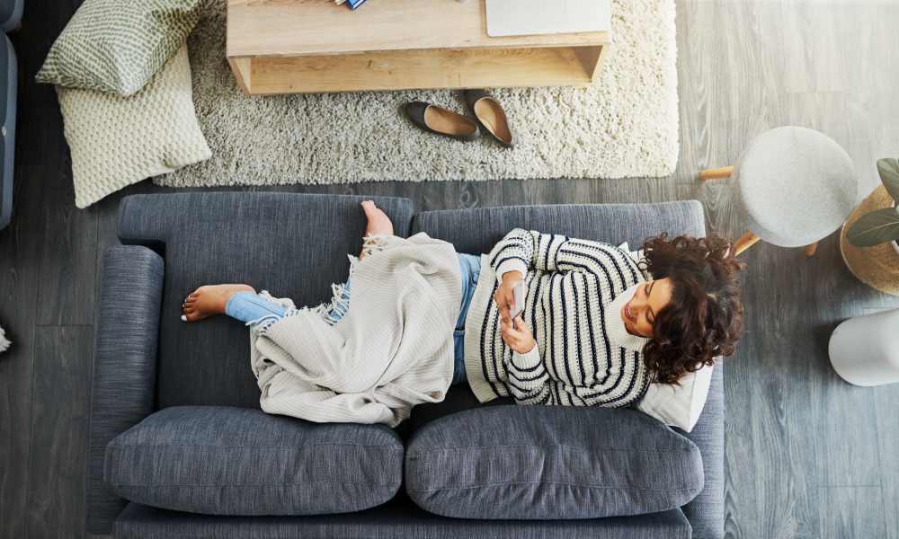 Resident woman in her couch at Avonlea Square in Smyrna, Georgia
