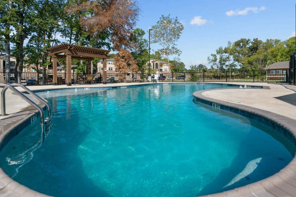 Swimming pool at Pebble Brook Apartments in Jacksonville, Texas