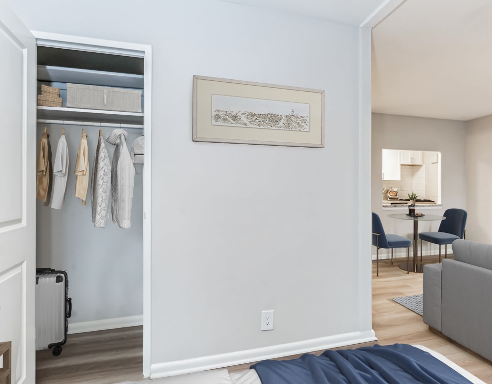 Bedroom with Sofa and Wardrobe at Merrill House Apartments in Falls Church, Virginia