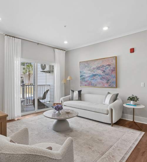 A decorated coffee table in an apartment living room at Everett at Port Wentworth in Port Wentworth, Georgia