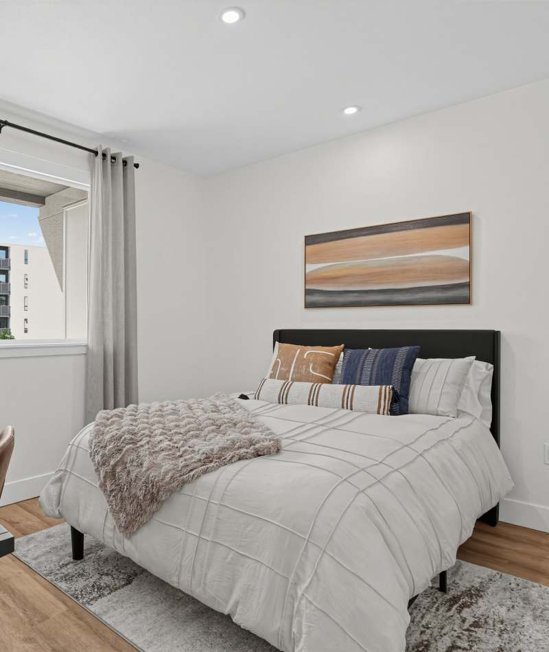 Bedroom with framed wall art at The Colton in Redwood City, California