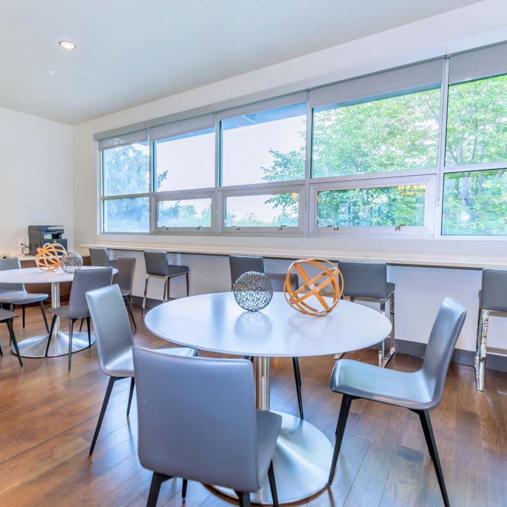 Community dining area with table and chairs at Park Place Olde Town Apartments in Arvada, Colorado