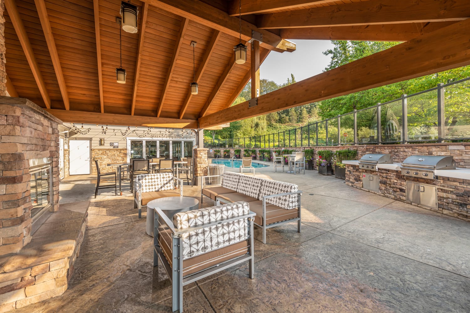 Outdoor covered barbecue area and community space at The Preserve at Forbes Creek in Kirkland, Washington
