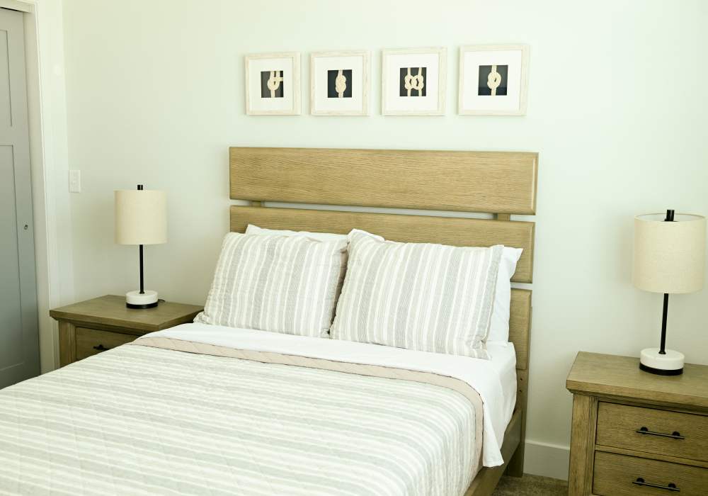 Model bedroom with beautiful wallart at Anchor Apartments in Freeport, Florida