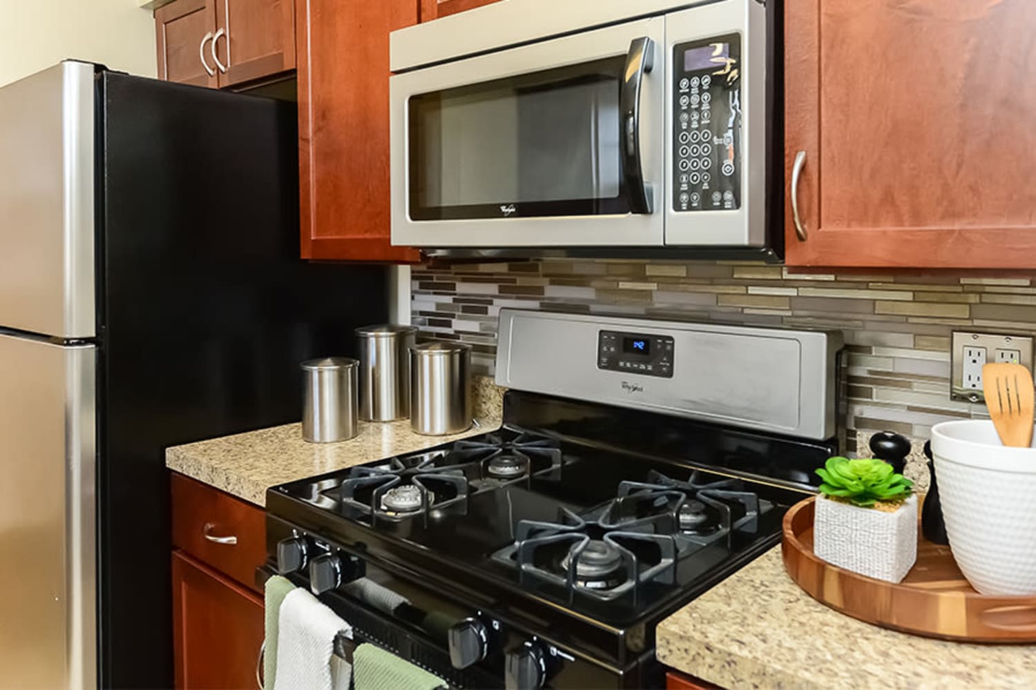Modern kitchen with stainless-steel appliances at Sherry Lake Apartment Homes in Conshohocken, Pennsylvania
