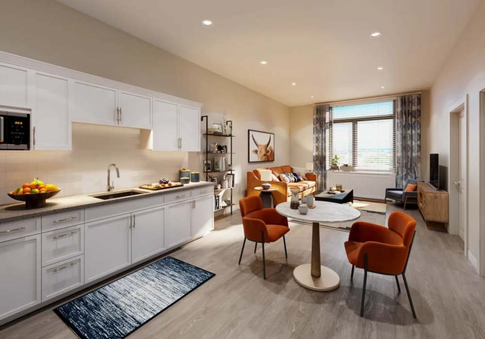 Living room and dining room with large windows at Clearwater at The Arboretum in Austin, Texas