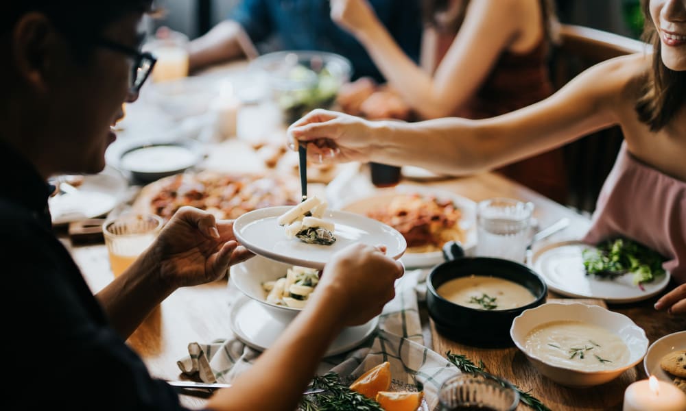 Residents enjoying fine dining at a restaurant near Brookside Heights Apartments in Cumming, Georgia