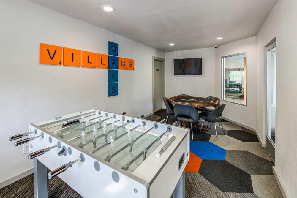 Game room with Foosball and a poker table at Village Oaks in Chino Hills, California