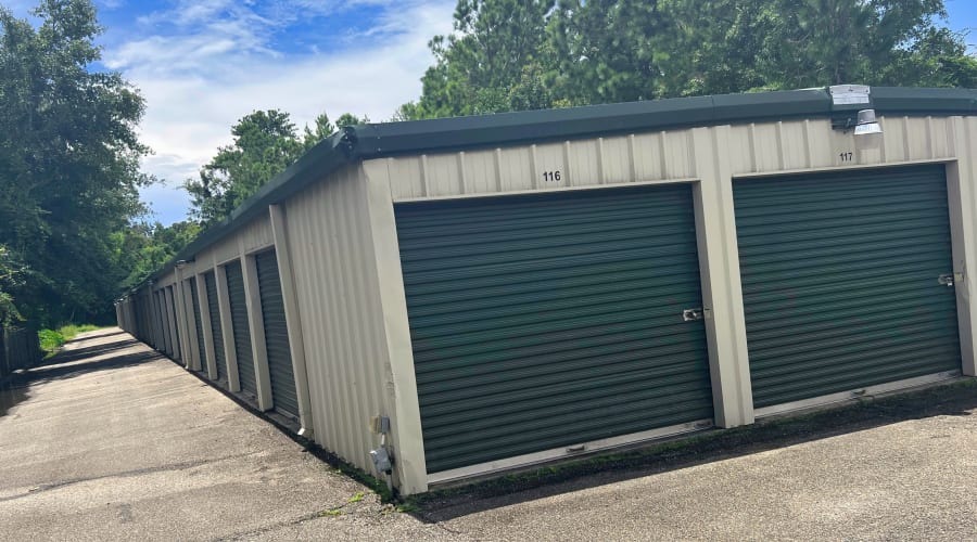 A family carrying storage boxes into their new home near KO Storage in D'Iberville, Mississippi