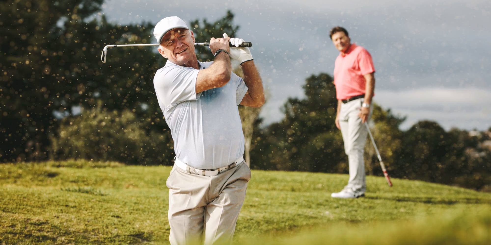 Two men playing golf near Blossom Ridge in Oakland Charter Township, Michigan