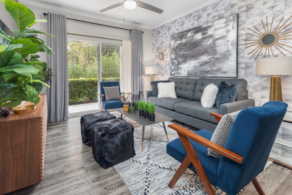 Hardwood floors in living room with porch access at Mezza in Jacksonville, Florida