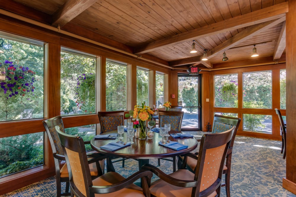 Dining table close to windows at The Firs in Olympia, Washington