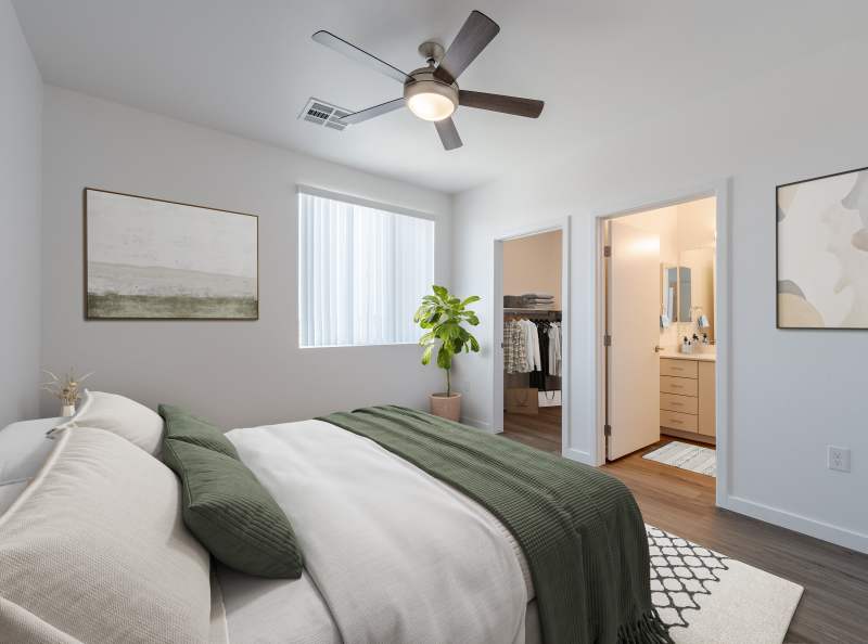Bedroom with ceiling fan at Dahlia Village in Phoenix, Arizona