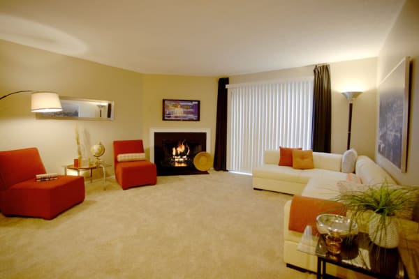 Spacious living room with a fireplace in a model apartment home at Lakeside at the Sanctuary in Columbus, Ohio
