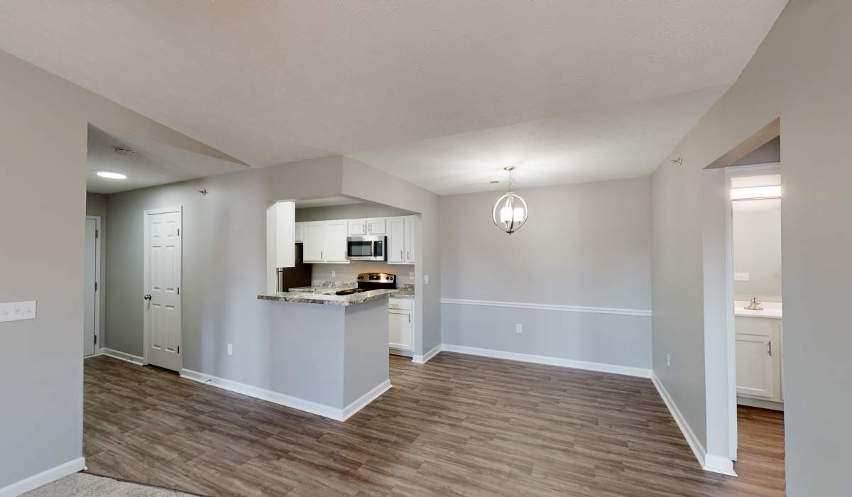 Open kitchen with wood flooring at Burlington Oaks in Burlington. KY