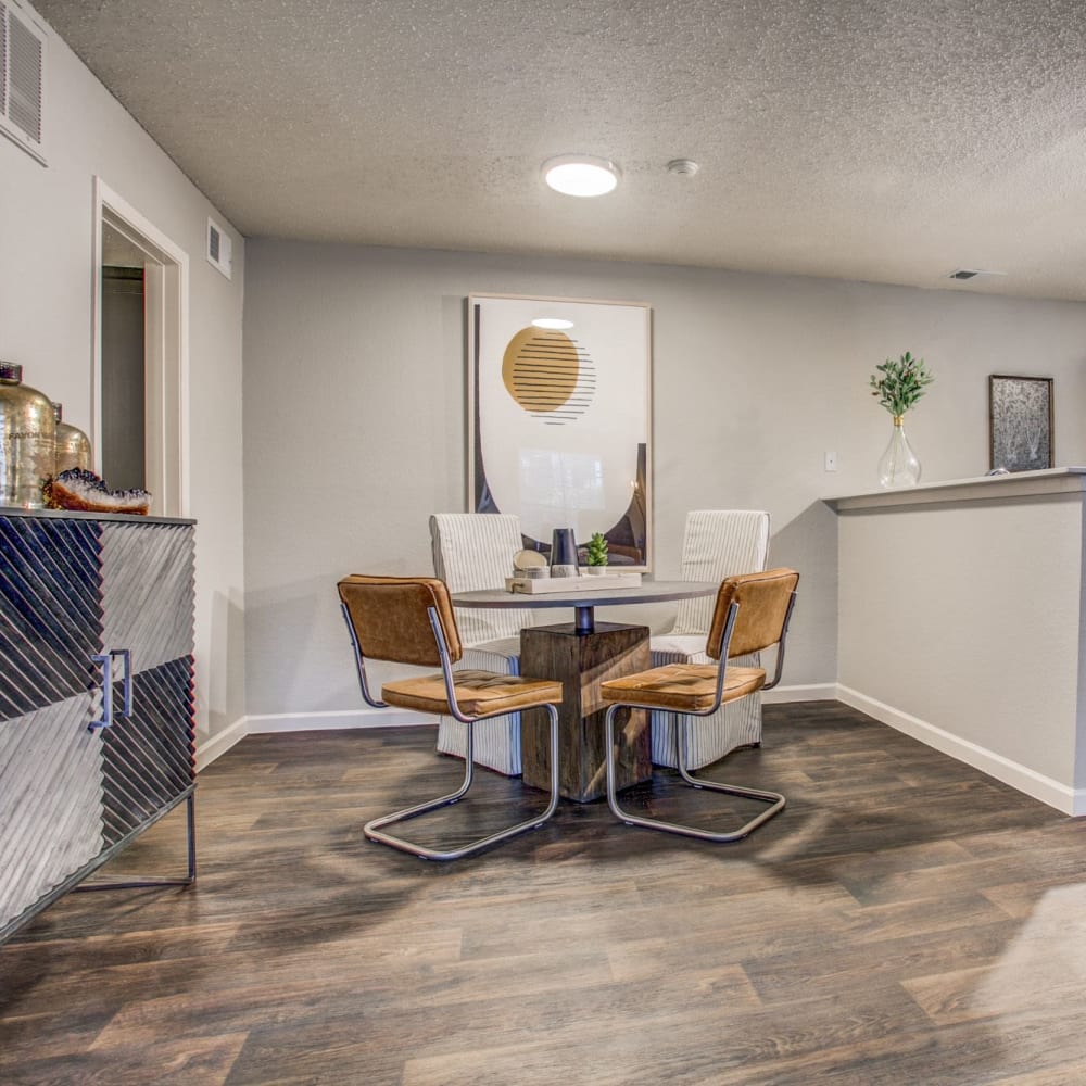 Kitchen with wood-style flooring and a breakfast counter at The Reese at Eastchase in Fort Worth, Texas