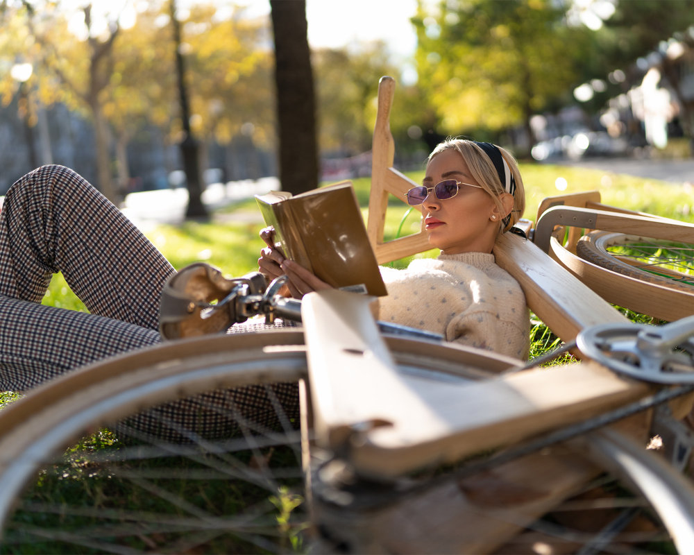 Resident reading a book near The Millton in Redwood City, California