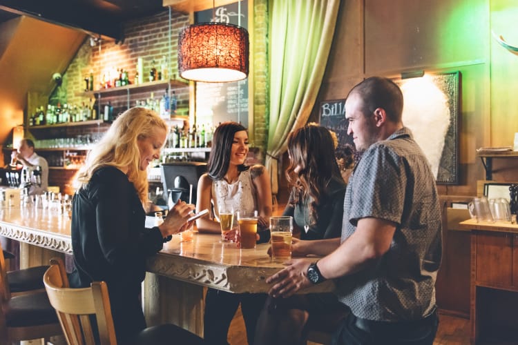 Friends enjoying some drinks near 12 South Flats in Nashville, Tennessee