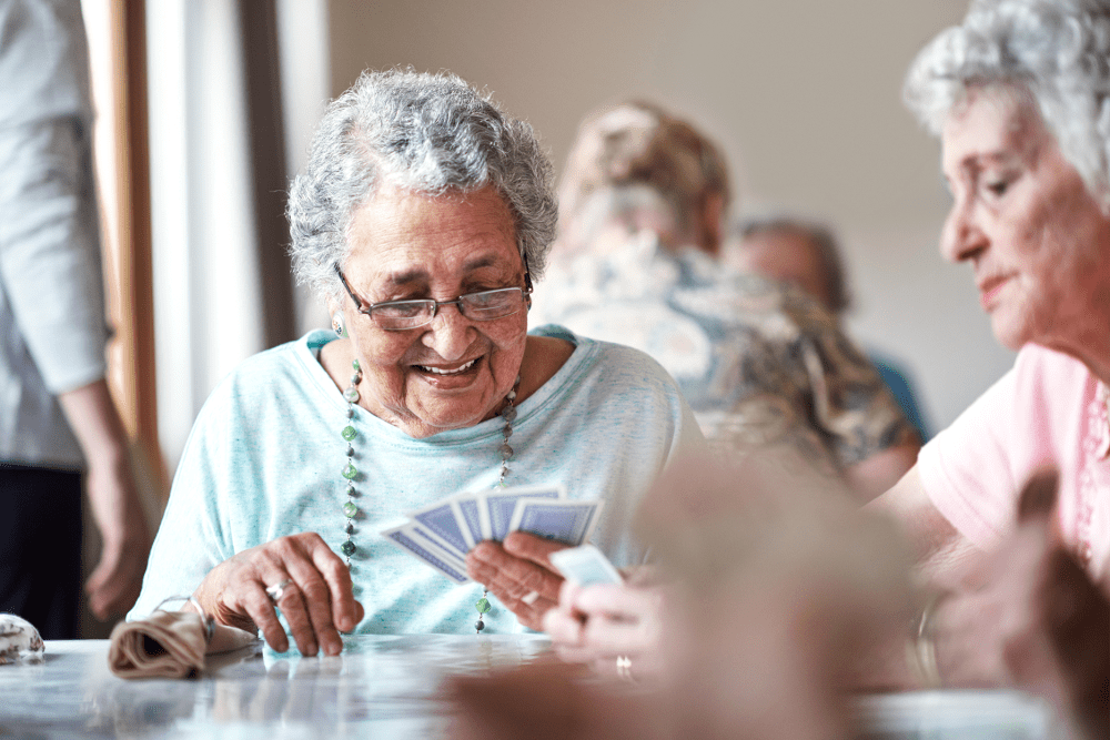 residents playing cards at Traditions of Cross Keys in Glassboro, New Jersey