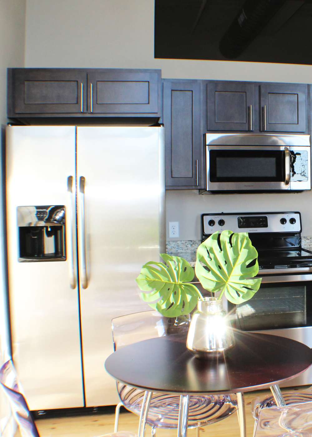 Luxury kitchen with stainless steel appliances and granite at Commonwealth Landing Lofts in Fall River, Massachusetts