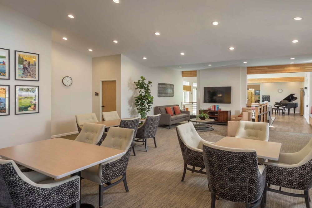 Spacious lounge area with piano in The Springs at Clackamas Woods at Milwaukie, Oregon