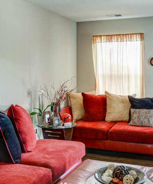 Living room with a couch and a window at The Banks At Berkley in Norfolk, Virginia