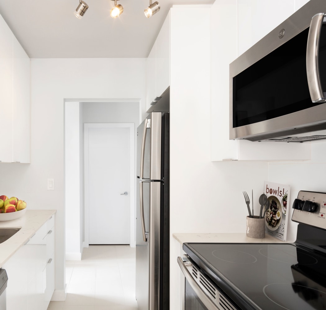 Magnificent kitchen with stainless-steel microwave at Fraser Tolmie Apartments in Victoria, British Columbia