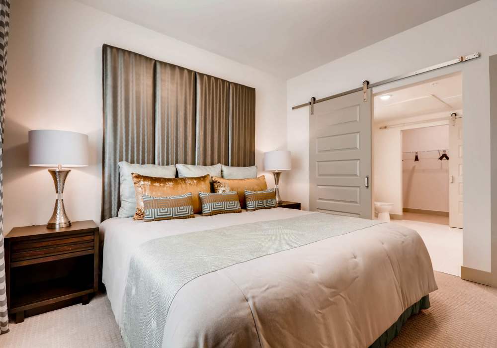 Bedroom with wood-style flooring at Station A Apartments in Denver, Colorado
